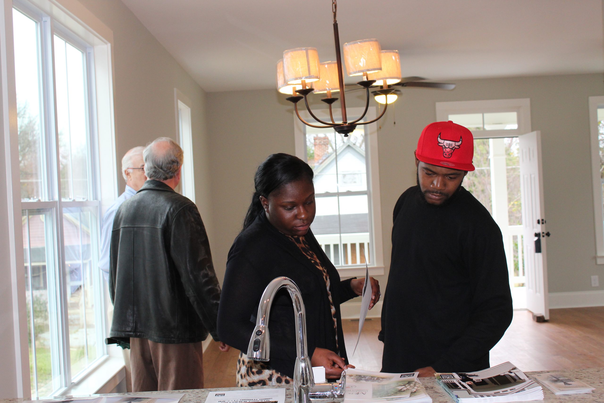 Prospective homebuyers review the benefits of buying a house from Historic Macon. (Photo Credit: Historic Macon)