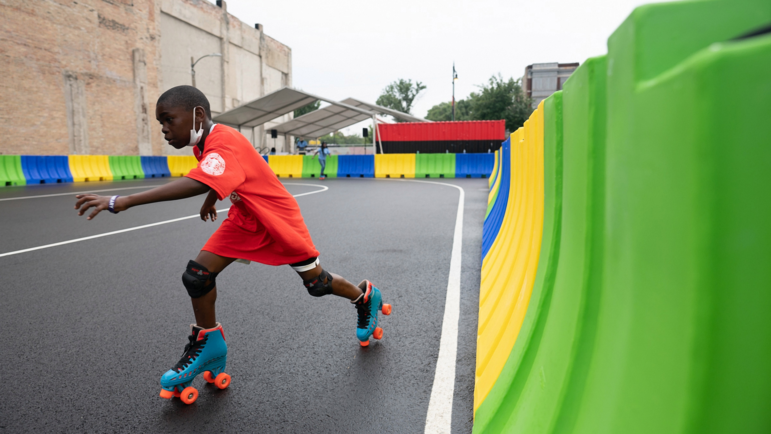 Damarion Weatherspoon skates at the community plaza and outdoor roller rink at Madison Street and Pulaski Road in West Garfield Park on August 6, 2021.