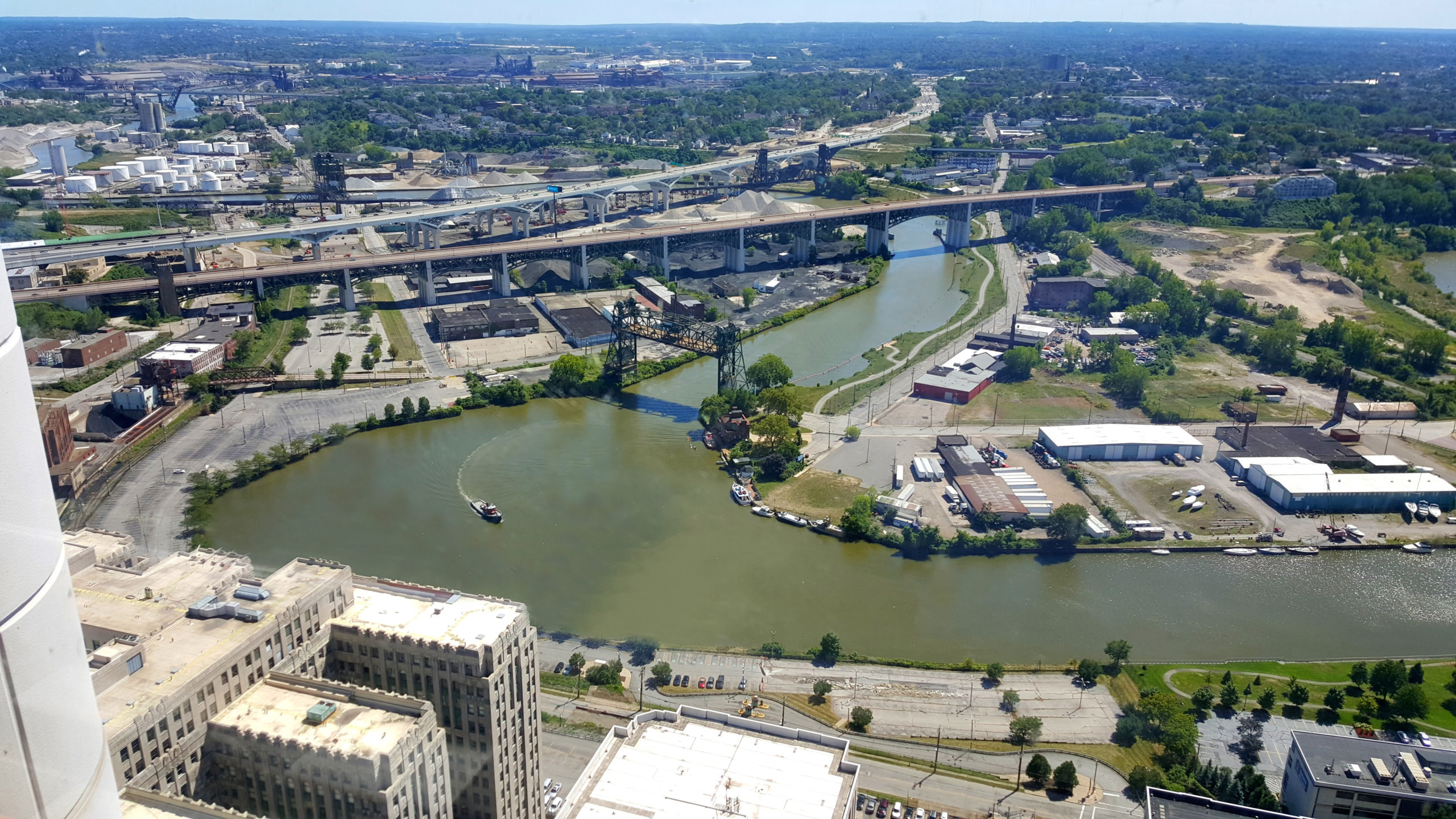 Aerial view of the Cuyahoga River in downtown Cleveland, Ohio, a river surrounded by urban infrastructure.