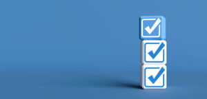 A stack of blue and white checkboxes on a dark blue background