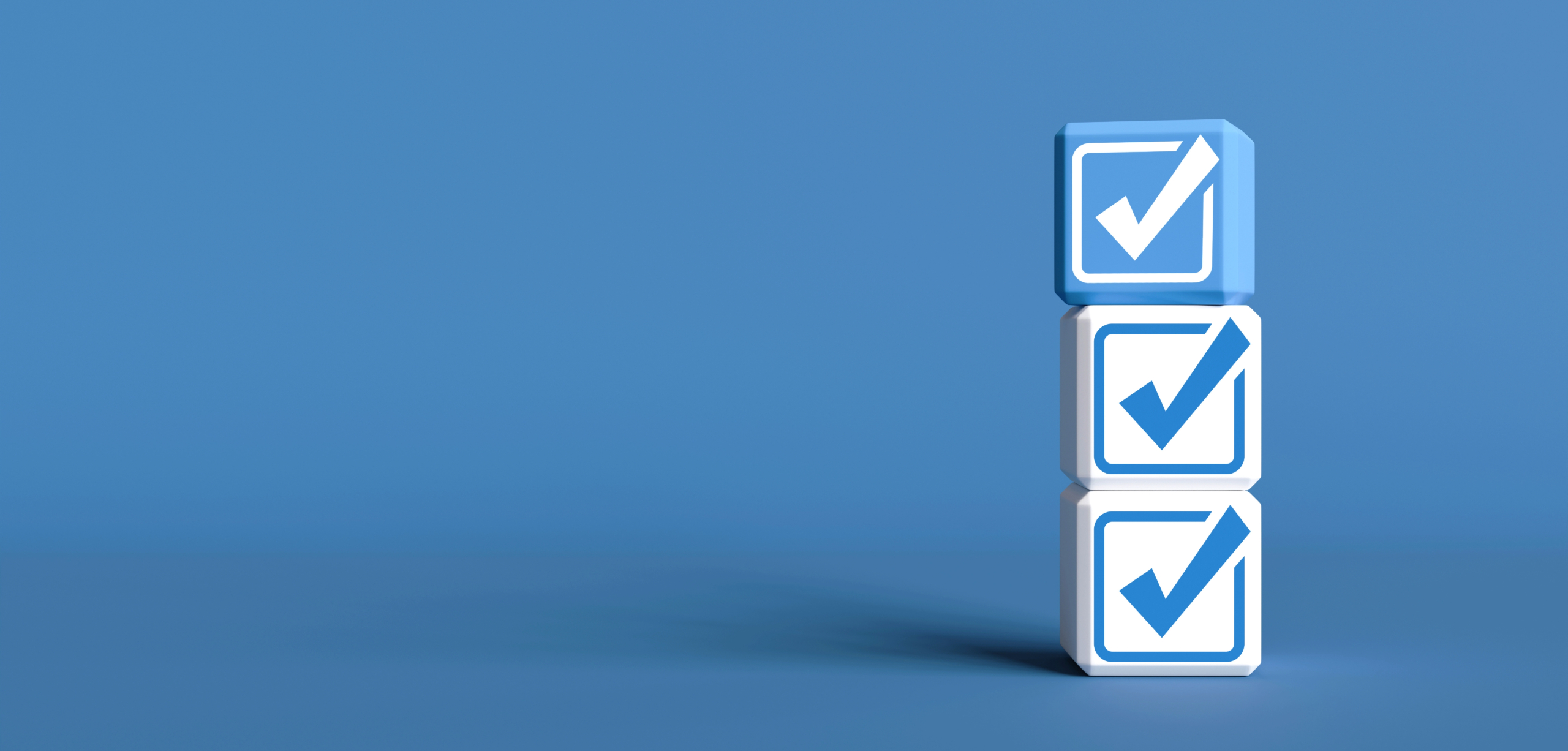 A stack of blue and white checkboxes on a dark blue background