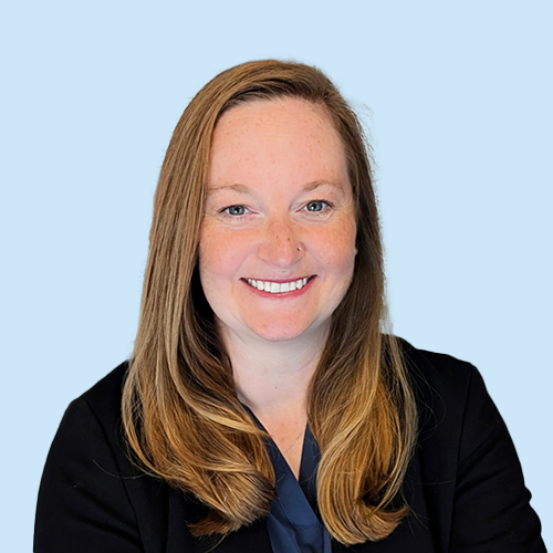 Headshot of Monica Passeno on a blue background